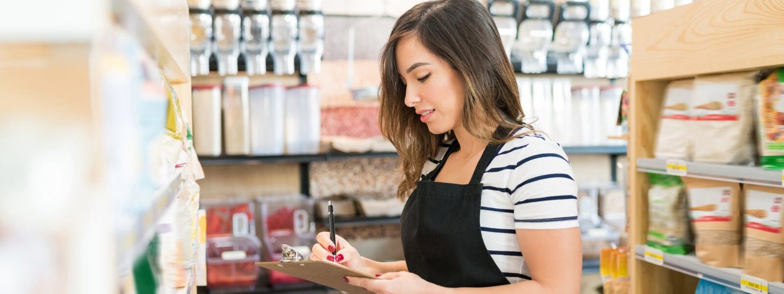saleswoman writing on clipboard in supermarket 2026 01 09 10 59 47 utc